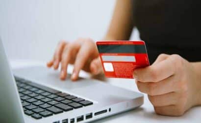 Person entering credit card details while handing over the credit card